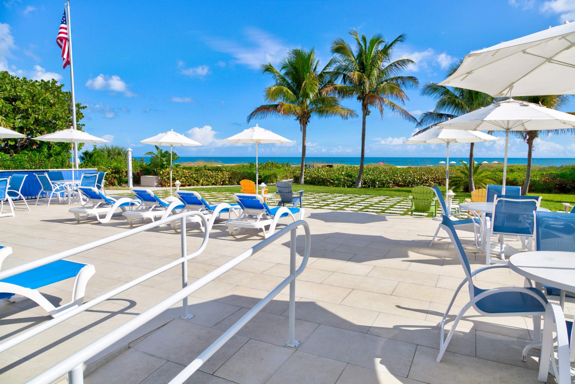 Reclining beach chairs with palm trees