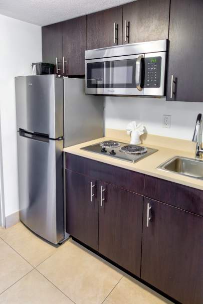Kitchen with fridge and microwave